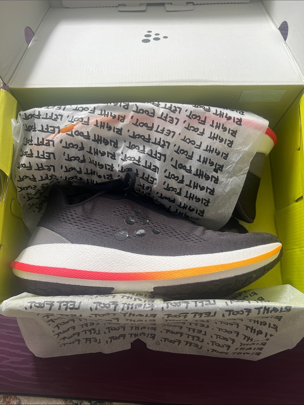 Craft Men's Black Running Shoe with Orange and Red Accents